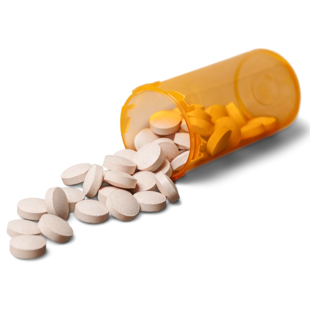 Pills spilling from a bottle